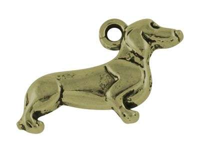 Přívěsek ve tvaru psa jezevčíka ve starozlaté barvě.